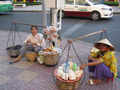 Street vendors - selling wafles, fruits, noodles, water, whatever..